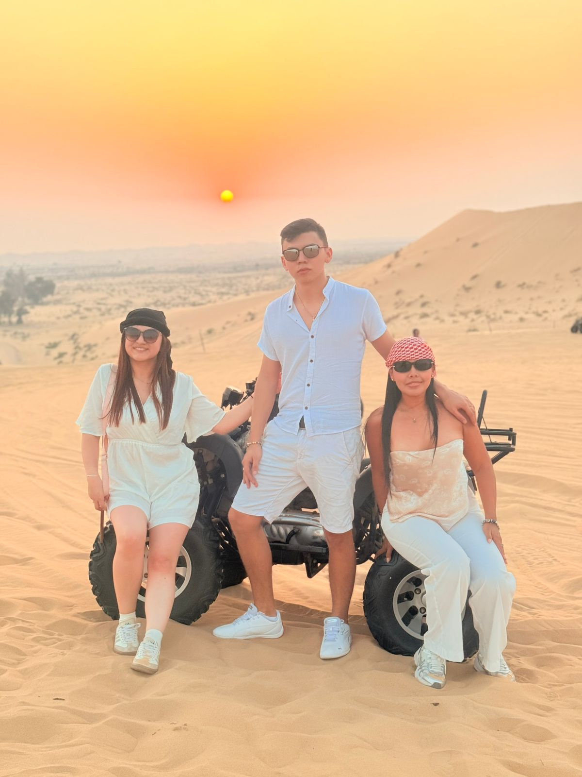 A fun, affordable group enjoying our cheap desert safari in Abu Dhabi without compromising on the experience