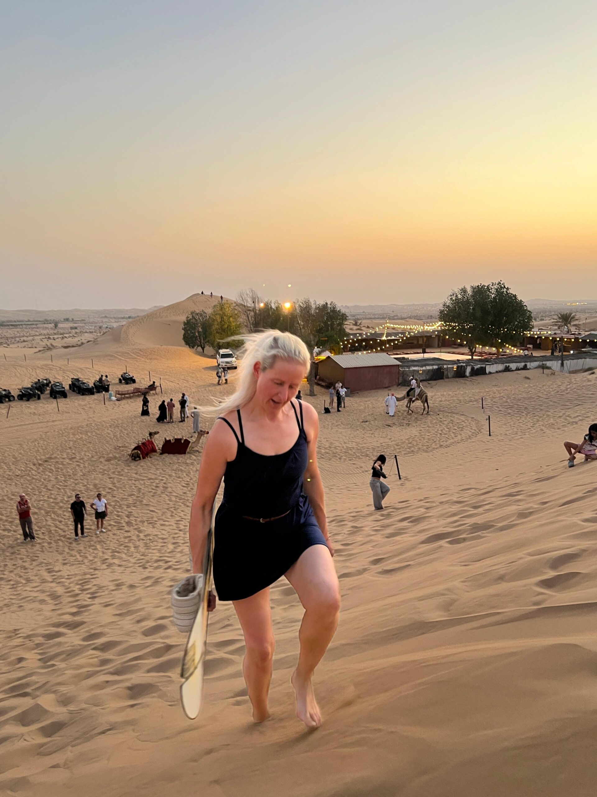 A breathtaking desert sunset over the golden dunes of Abu Dhabi during a serene evening