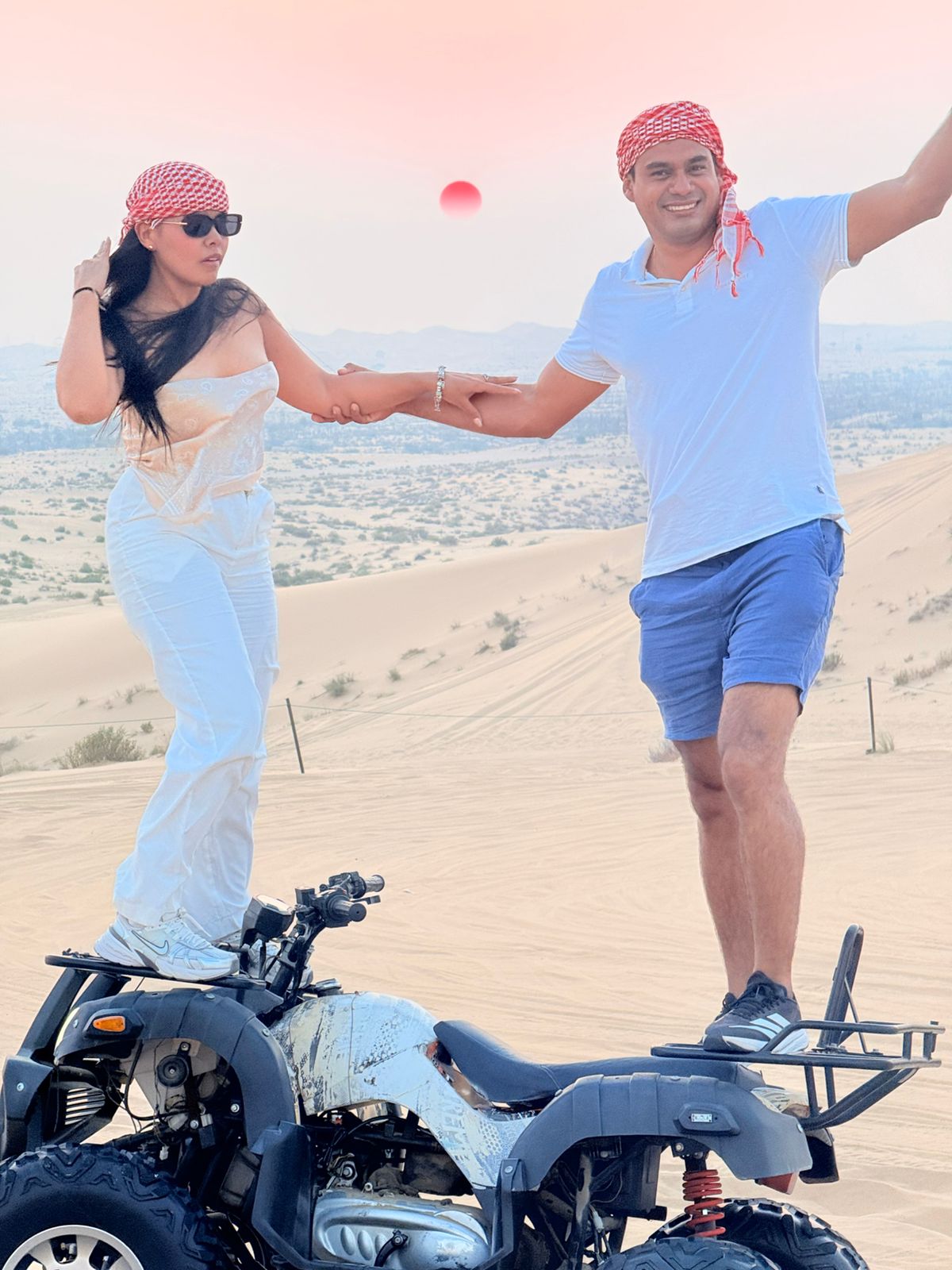 A breathtaking sunrise over the red dunes of Abu Dhabi at the start of a morning desert safari